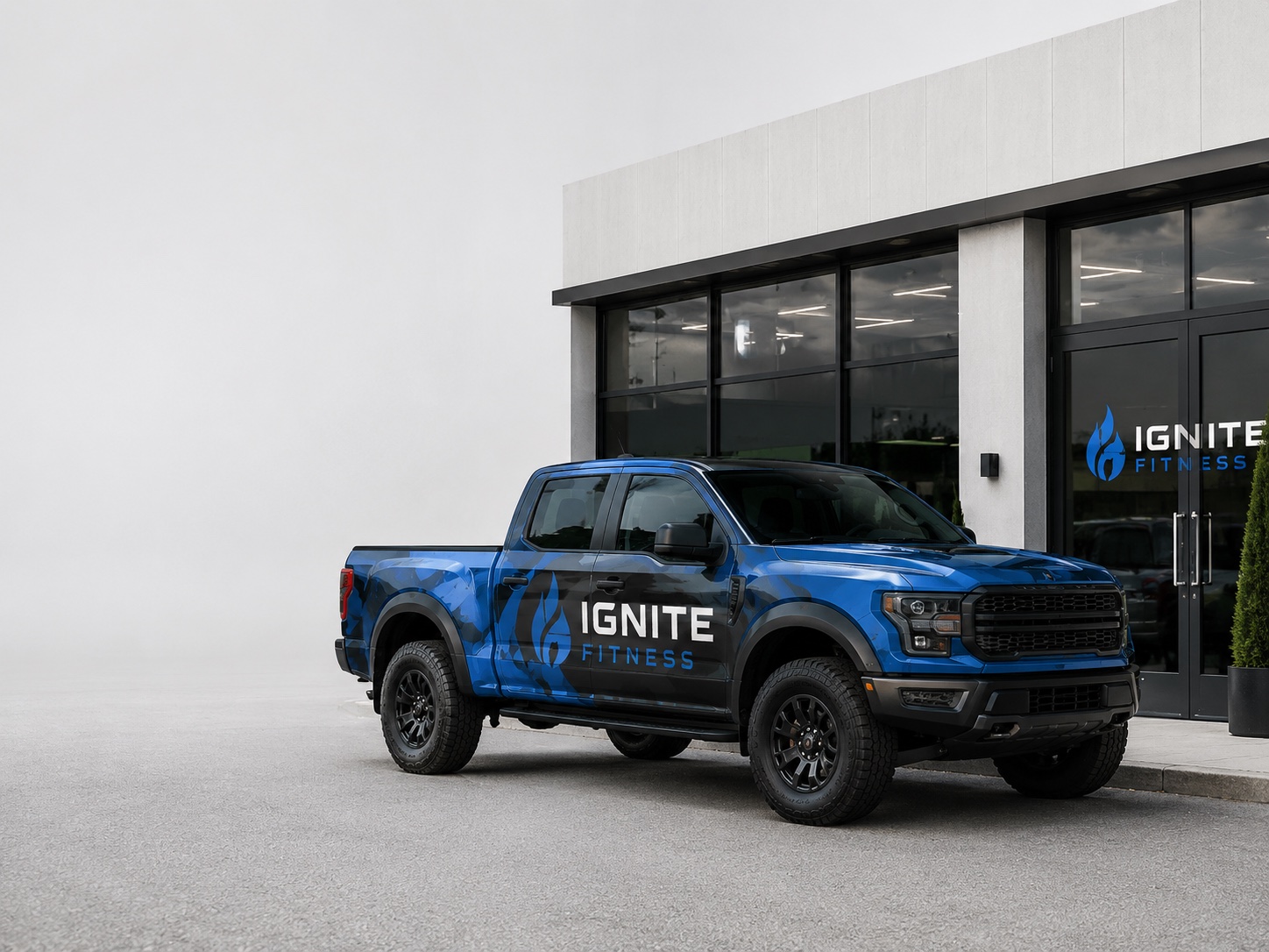 Pickup truck with full custom vehicle wrap parked outside a branded storefront